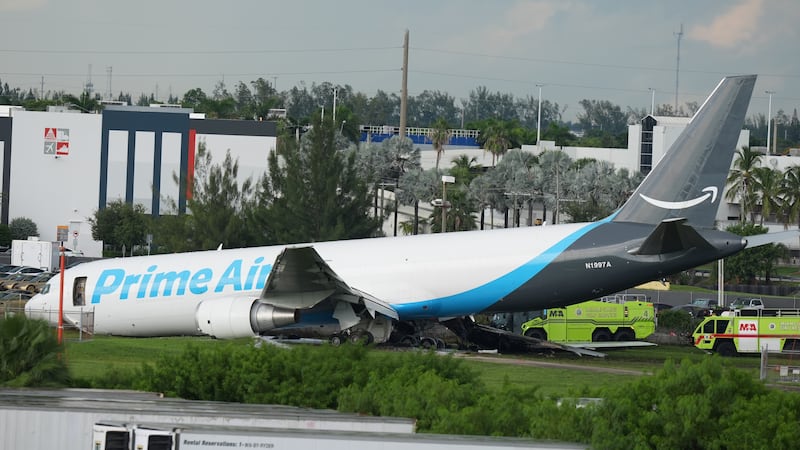 An Amazon cargo plane sits at the Miami International Airport (MIA) after it overshot the...