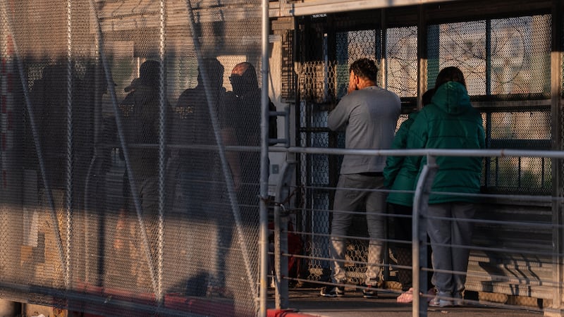 FILE - A group of undocumented migrants is deported by U.S. Immigration and Customs...