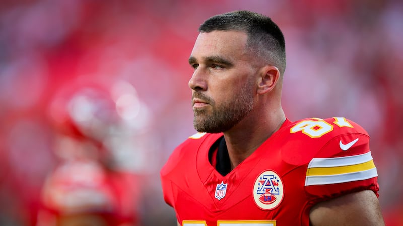 Kansas City Chiefs tight end Travis Kelce takes a break during warmups before the first half...