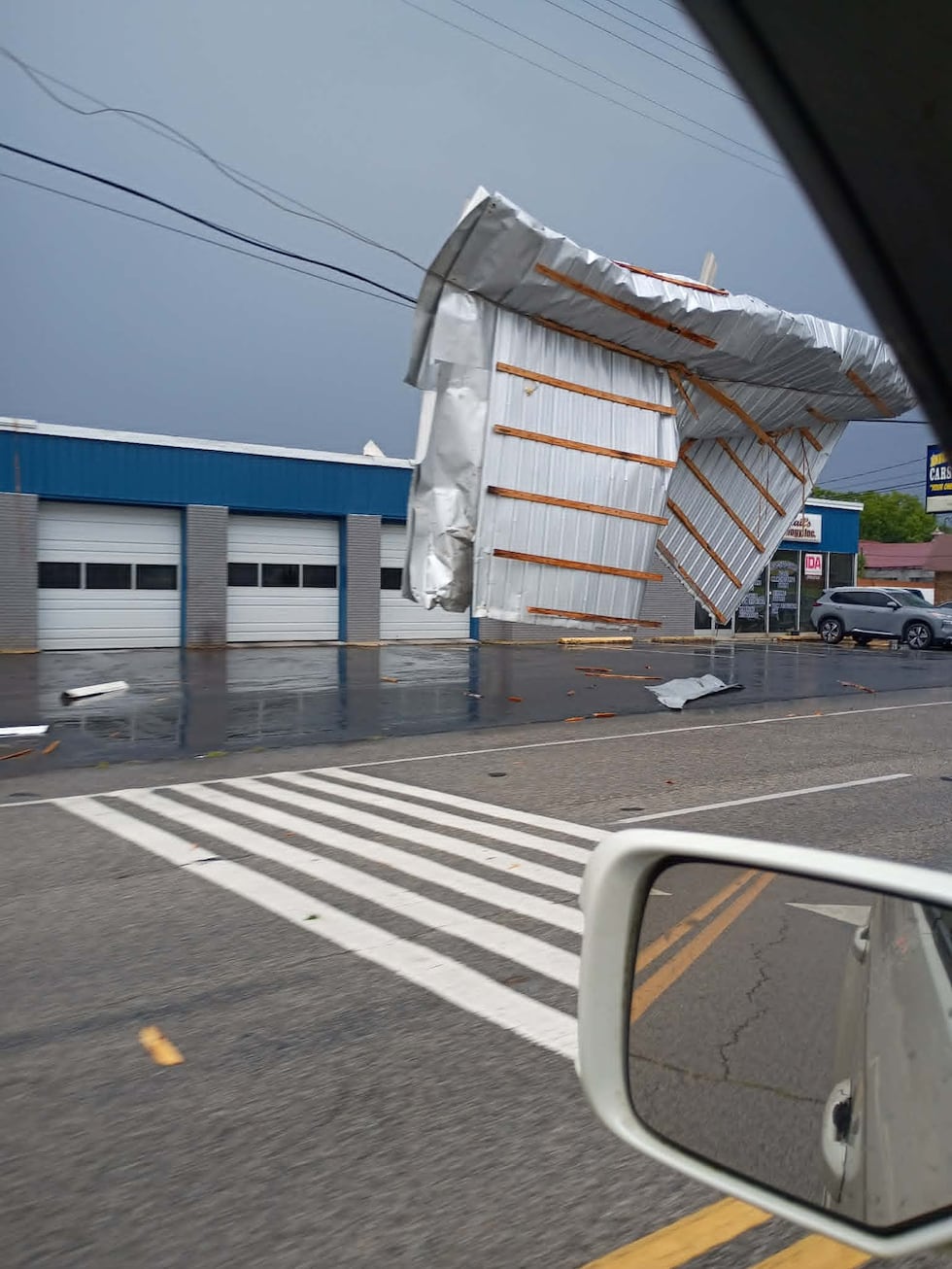 A large piece of metal sheeting was seen wrapped around a power line in Manchester, Tennessee,...