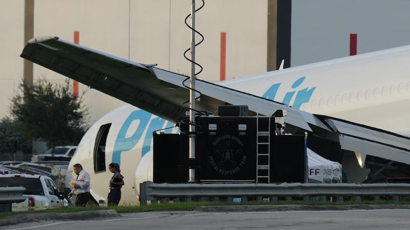 An Amazon cargo plane sits at the Miami International Airport (MIA) after it overshot the...
