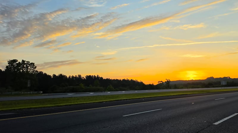The sun rises while what driving along Interstate 22 E in Walker County Saturday morning.