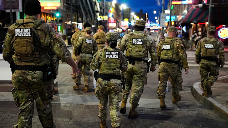 Members of the National Guard conduct a community safety patrol on Beale Street, Friday, Oct....